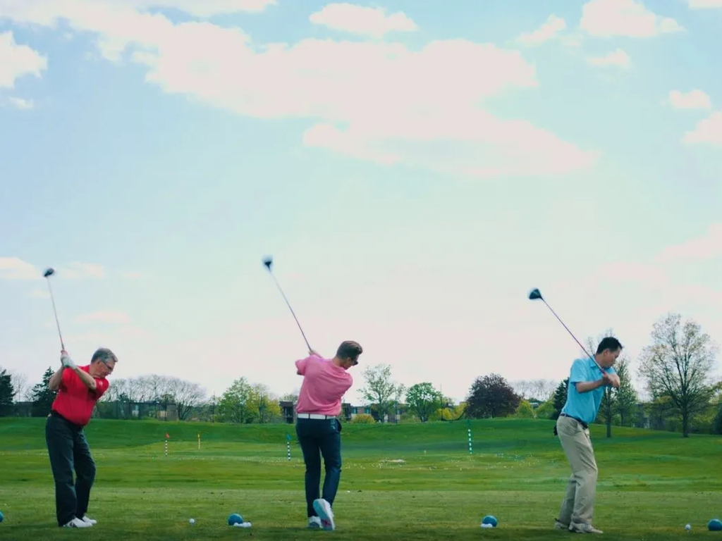 Golfers at golf course range